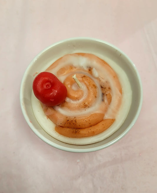 Realistically Scented CINNAMON ROLL candle .